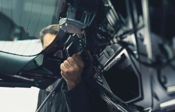 Collision Technician tearing down a vehicle for repair Vehicle in Prep for collision repair
